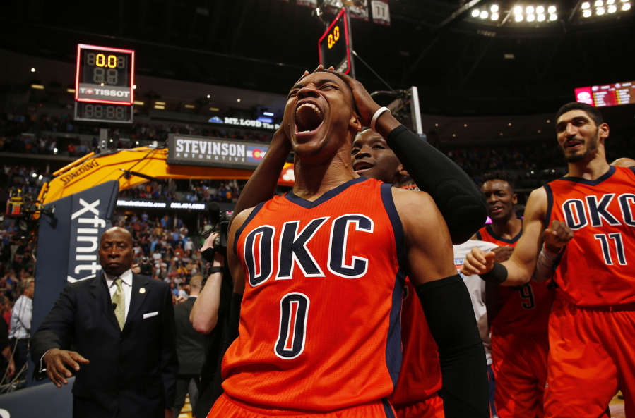 Oklahoma City Thunder guard Russell Westbrook celebrates after hitting a buzzer beater three point shot to win the game against the Denver Nuggets following a basketball game Sunday, April 9, 2017, in Denver. Oklahoma City beat Denver 106-105. Westbrook also broke the NBA record for triple doubles with 42.