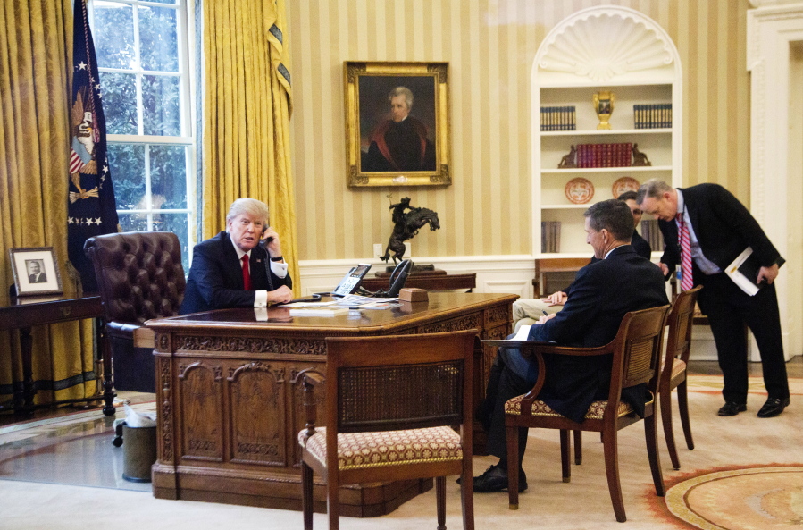 President Donald Trump, from left, accompanied by then-National Security Adviser Michael Flynn, Senior Adviser to the President Jared Kushner and White House press secretary Sean Spicer, speaks by phone with the King of Saudi Arabia on Jan. 29 in the Oval Office.