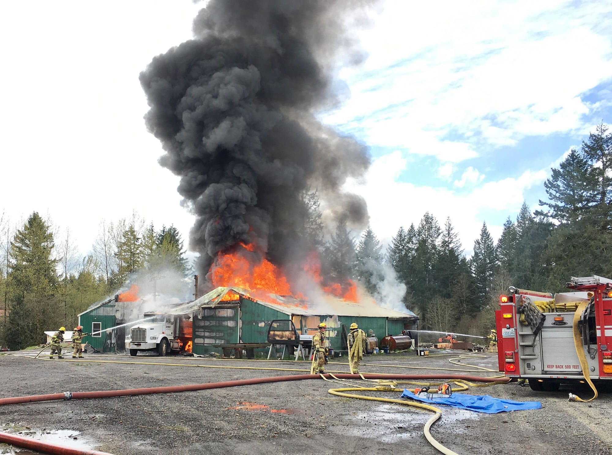 A two-alarm fire destroyed a pole barn Wednesday afternoon northwest of Battle Ground.
