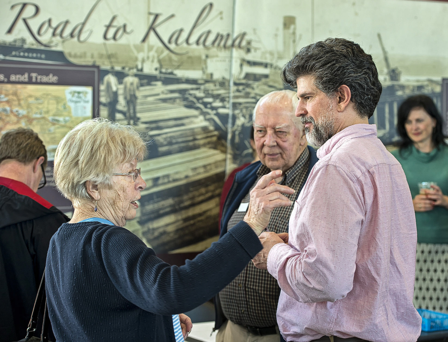 Historian Tim Hills, right, talks with Kalama residents Jean Akre, left, and her husband, Paul Akre, at a recent Port of Kalama open house.