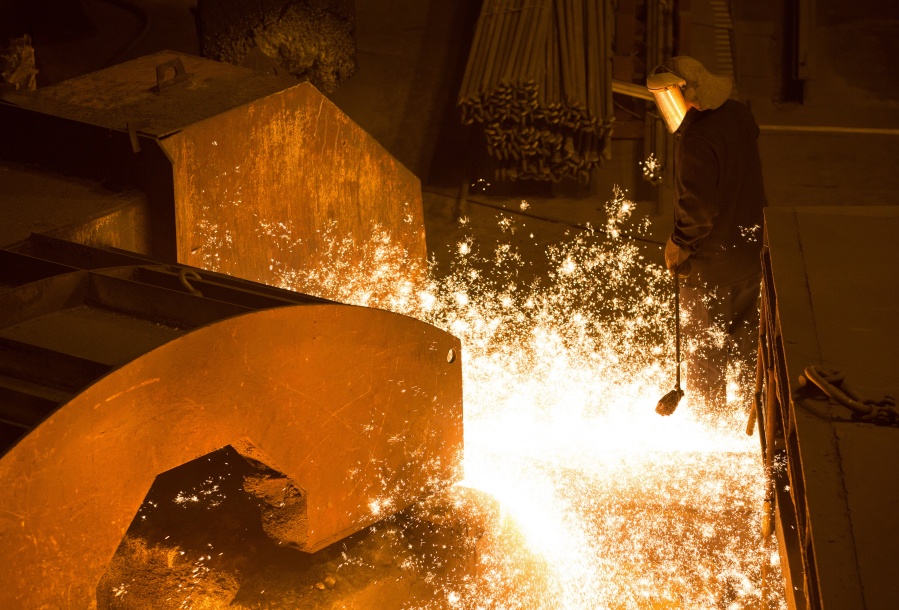 Andrey Rudakov/Bloomberg
A worker uses a ladle to collect a sample of molten iron from the furnace at a steel mill in Cherepovets, Russia.