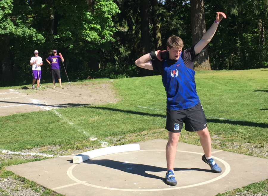 Ridgefield High School freshman Trey Knight competes in the shot put at the Class 2A District 4 meet Friday at Columbia River High School. Knight's winning mark of 60 feet, 9 inches is the farthest by a freshman in state history.