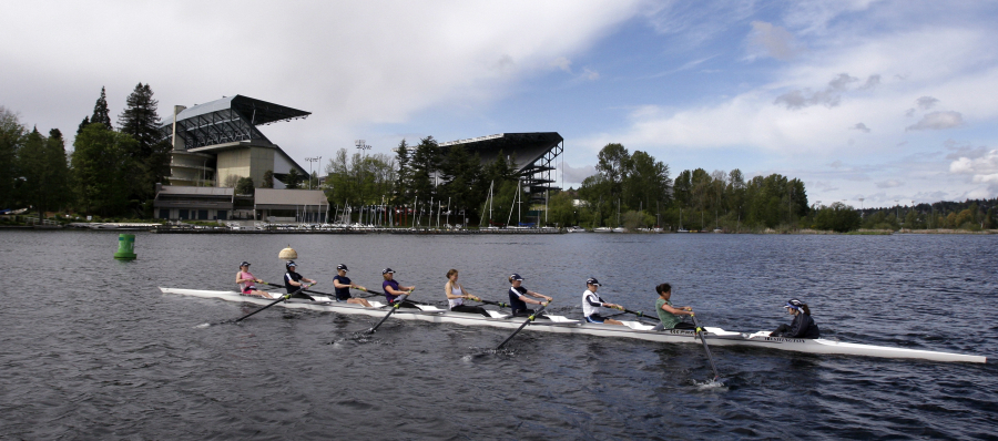 An 8-person rowing team practices on Lake Washington before the Windermere Cup in Seattle. The University of Washington rowing team has a roster full of athletes who learned to row in college, including Columbia River graduate Katelyn Costanza.