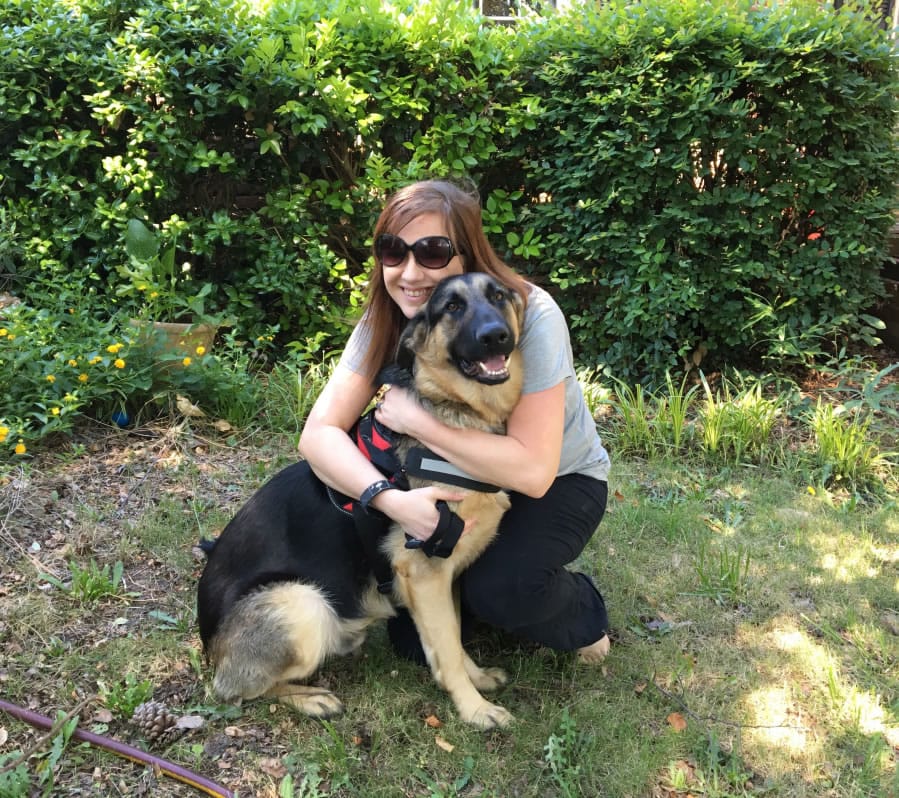 The author with Queequeg, her German shepherd being trained as a service dog.