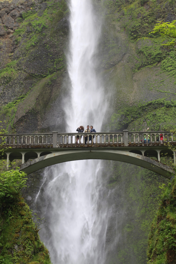 People gather from the bridge in front of Multnomah Falls near Bridal Veil, Ore. The United States’ second-tallest year-round waterfall is a huge draw.