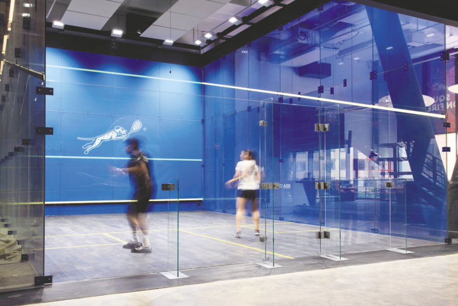 Amir Wagih, left, and Eunice Tan, coaches at Squash on Fire in the District, practice at the company’s new $12 million boutique facility. With its pay-to-play model, it hopes to open up the sport to players who don’t want to shell out for a gym membership.