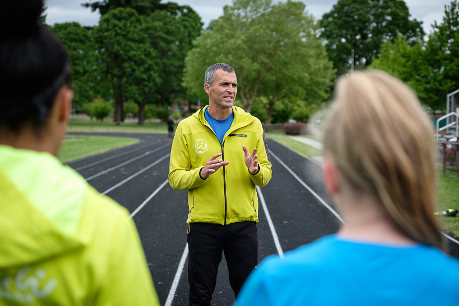 Dave Caldwell, center, coach at Whisper Running, teaches not only the mechanics of running, but also how to navigate mental barriers to success.