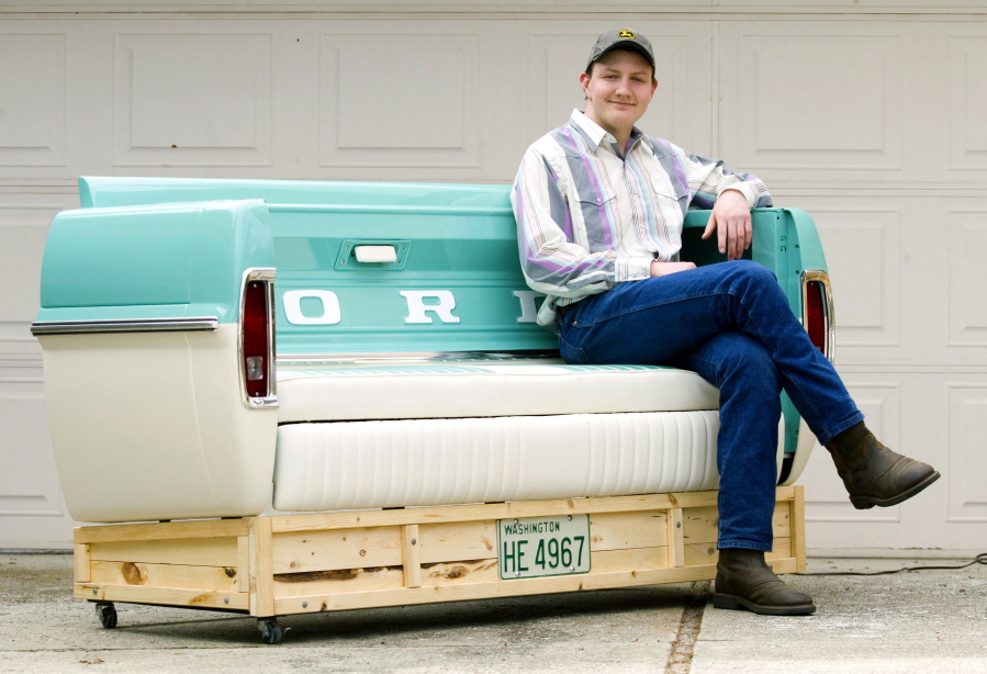 Pullman High School senior Brandon Libey sits in his 1967 Ford bench outside his home in Pullman on April 25. Libey built the bench as his high school senior project with mentor Steve Myers, Jr. The bench was inspired by a 1967 Ford F-100 Libey&#039;s grandfather, Gary Beedy, owned.