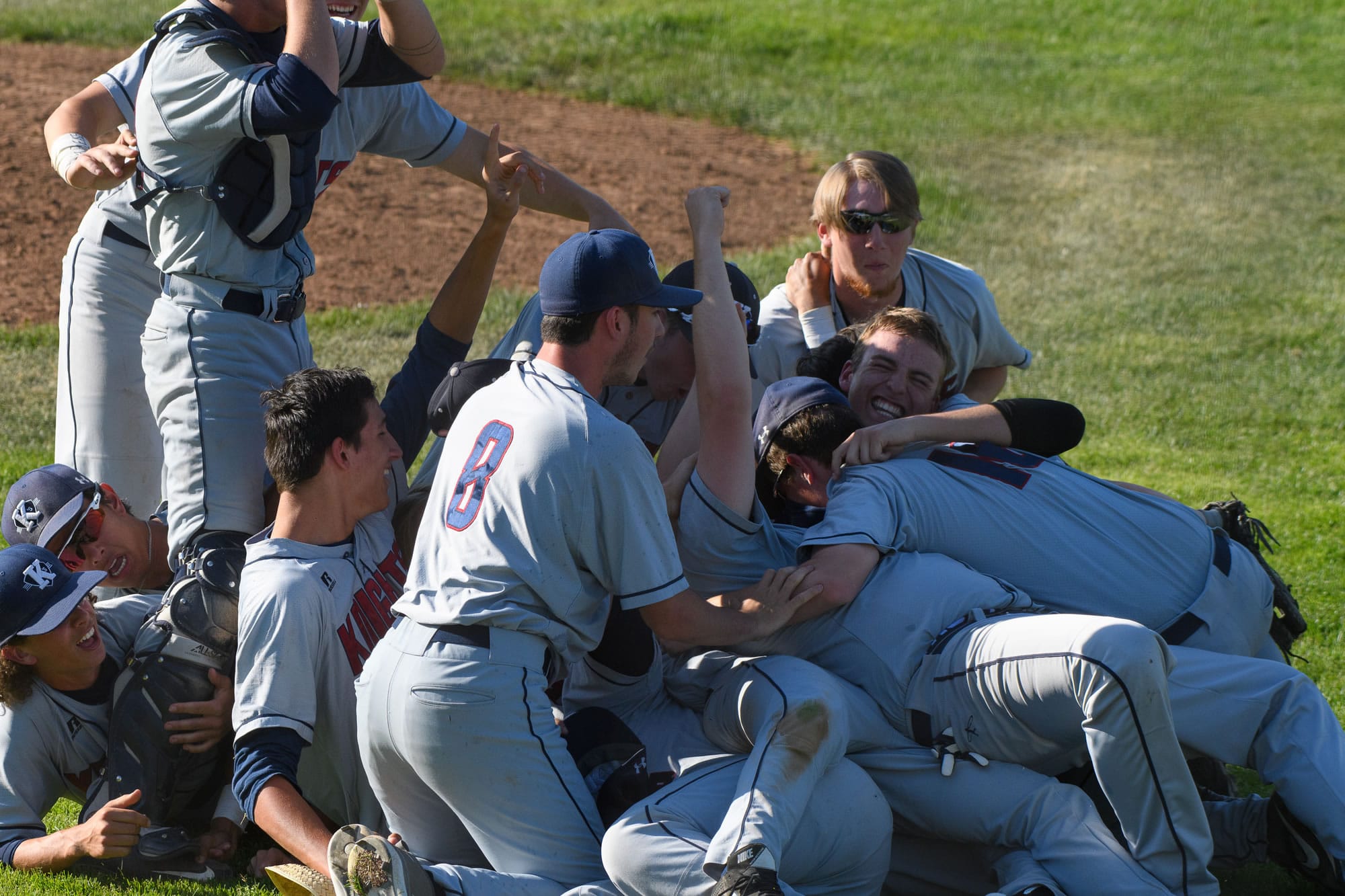 The King's Way Christian baseball team celebrates after winning the Class 1A state title with a 5-3 victory over Cedar Park Christian on Saturday in Yakima (Ken Waz/for The Columbian)