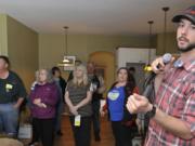 Estate Sale auctioneer Wade Boyd calls for bids on household items at a home in Vancouver in April.