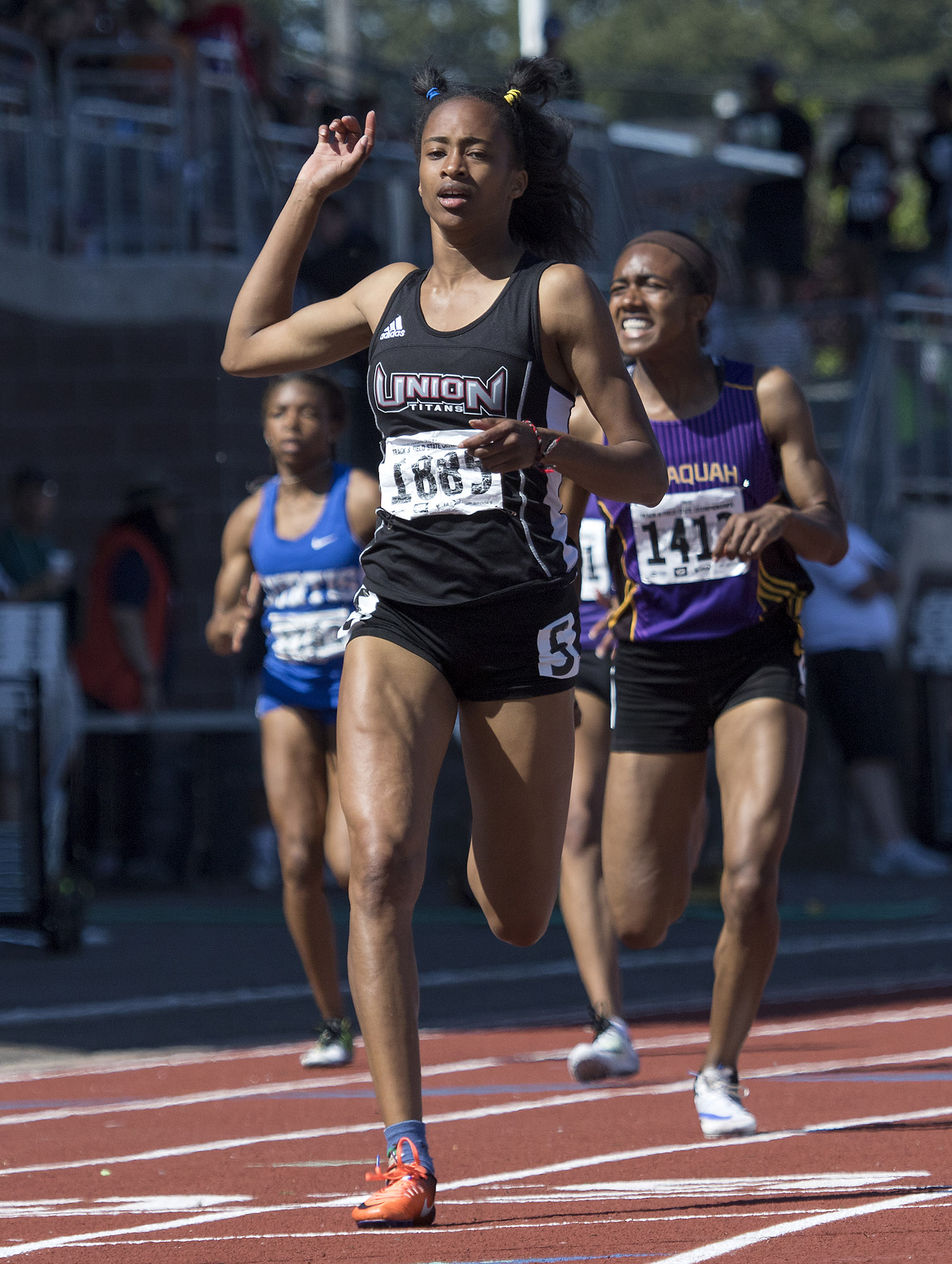 Union's Dai'lyn Merriweather reacts to crossing the finish line in 1st place in the 4A Girls 200 Meter Dash at the WA State Track and Field Meet Saturday, May 27, 2017, in Tacoma, Wash. Her sister, Jai'lyn finished 2nd.
