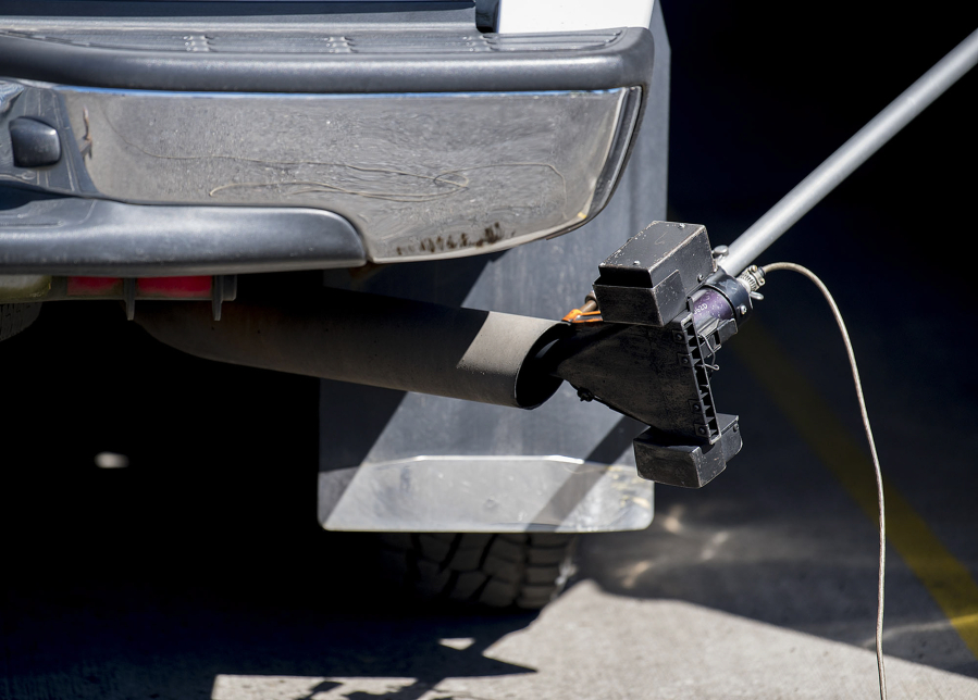 A sensor measures the amount of particulate emitted from a diesel engine during an emissions test State Emission Inspection Station in Northwest Vancouver.