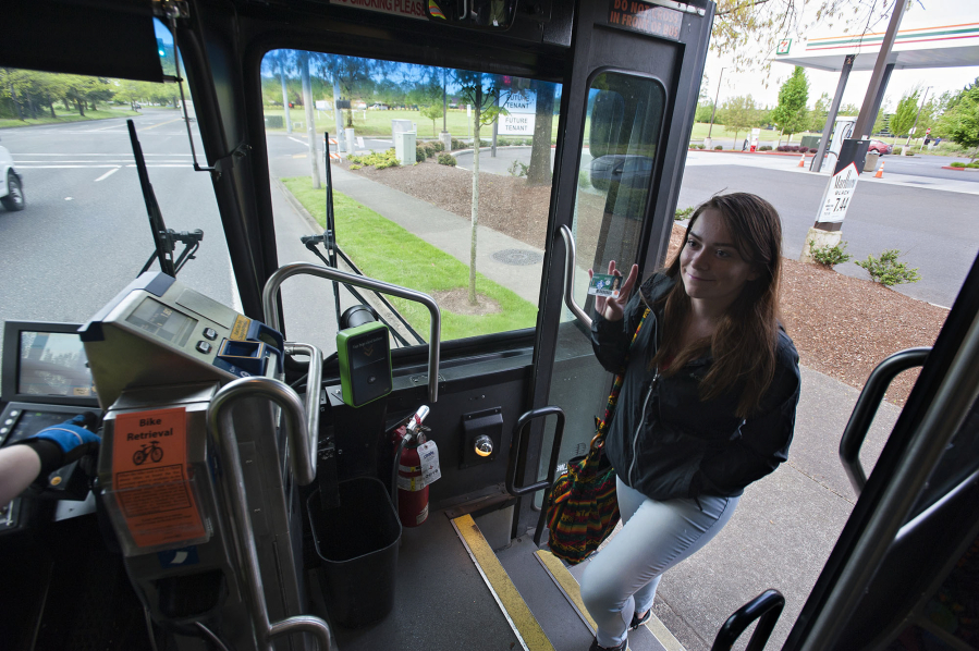 Mountain View High School junior Kaylee Hollingsworth, 17, boards the bus along Northeast 136th Avenue using her Youth Opportunity Pass on her way to school Wednesday.