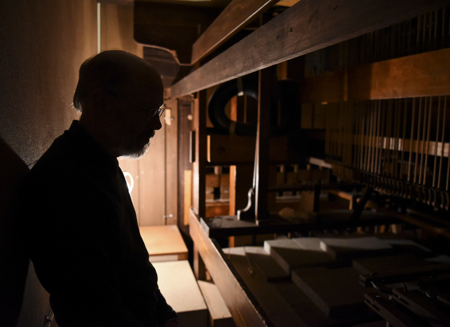 Richard Bond, a Portland organ builder, inside the 1895 pipe organ he recently worked on at St. Luke&#039;s ~ San Lucas Episcopal Church.