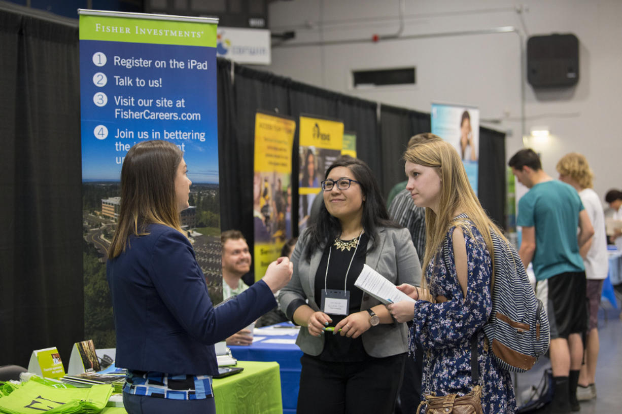 Jackie Carpenter, from left, and Kristina Chen of Fisher Investments talk with Acoya Rehak-Thompson, 17, of La Center as she looks for a summer job during the recent career fair at Clark College. Though unemployment is low, teen jobs are scarce.