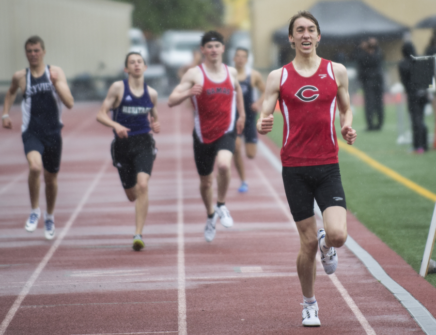 Ariane Kunze/The Columbian
Camas’ Daniel Maton, right, crosses the finish line coming in first in the 4A boys 800 meters in a time of 1:53.87.