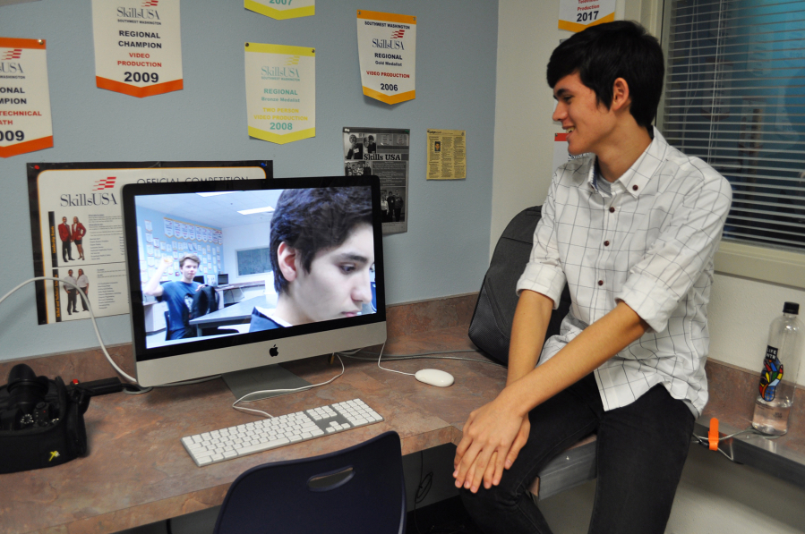 Skyview High School sophomore Jonathan Lane watches the silent film “Detention” that he produced with fellow students, senior Brendan Nash and sophomore Seth Yoshinobu.