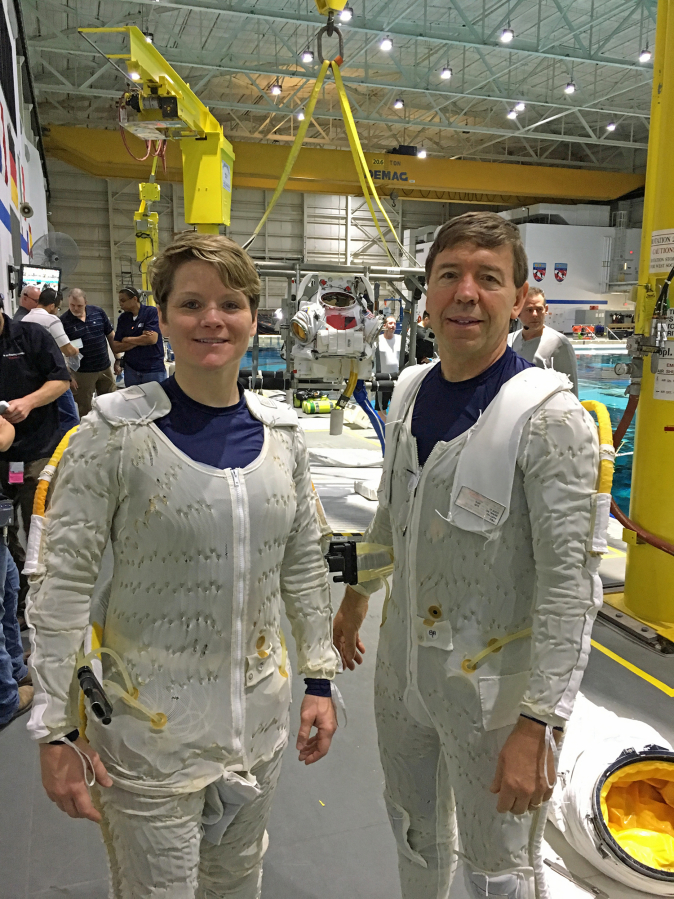 Astronauts Anne McClain, left, and 1977 Camas High School graduate Mike Barratt in their liquid-cooled garments before suiting up for an underwater training session in NASA’s neutral buoyancy tank. McClain flew 216 combat missions in Iraq as a Kiowa Warrior helicopter pilot.
