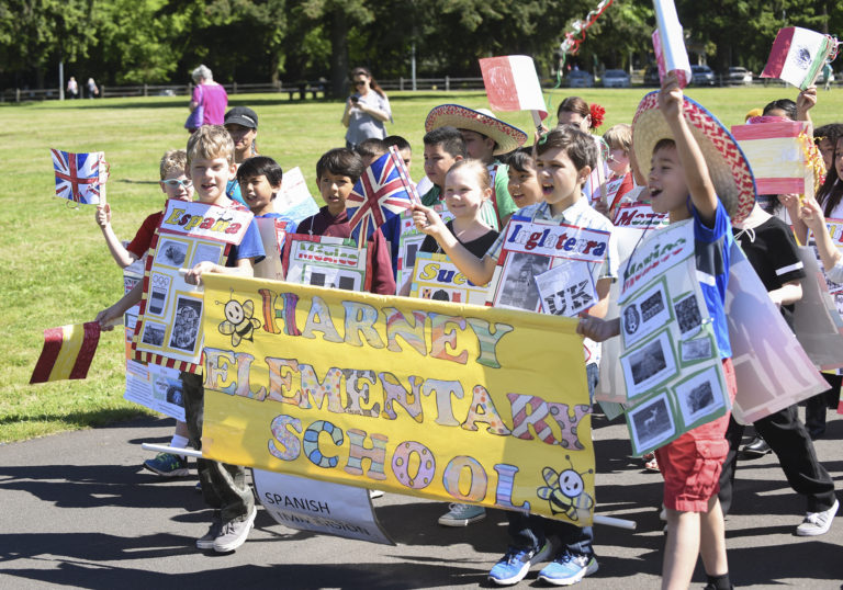 Harney Elementary School third graders march together in the annual Children's Culture Parade at Fort Vancouver National Historic Site, Friday May 19, 2017.