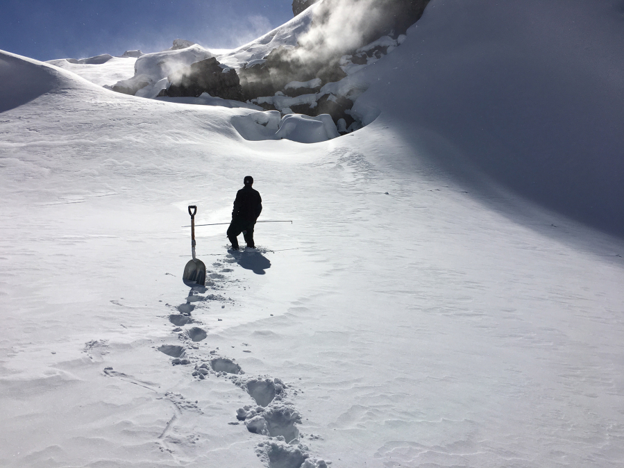 Chris Lockett, U.S. Geological Survey instrumentation scientist, at the spot where the September Lobe monitoring station is buried under 10 to 15 feet of snow during an April 21 trip into the crater of Mount St. Helens.