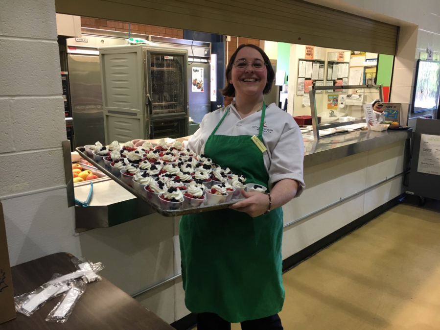 Fircrest: Fircrest Elementary School Chartwells Food Service staff member Stephanie Hilbert brings out blueberry shortcake for students to try as part of Washington State University Extension’s Supplemental Nutrition Assistance Program Education’s Harvest of the Month campaign.