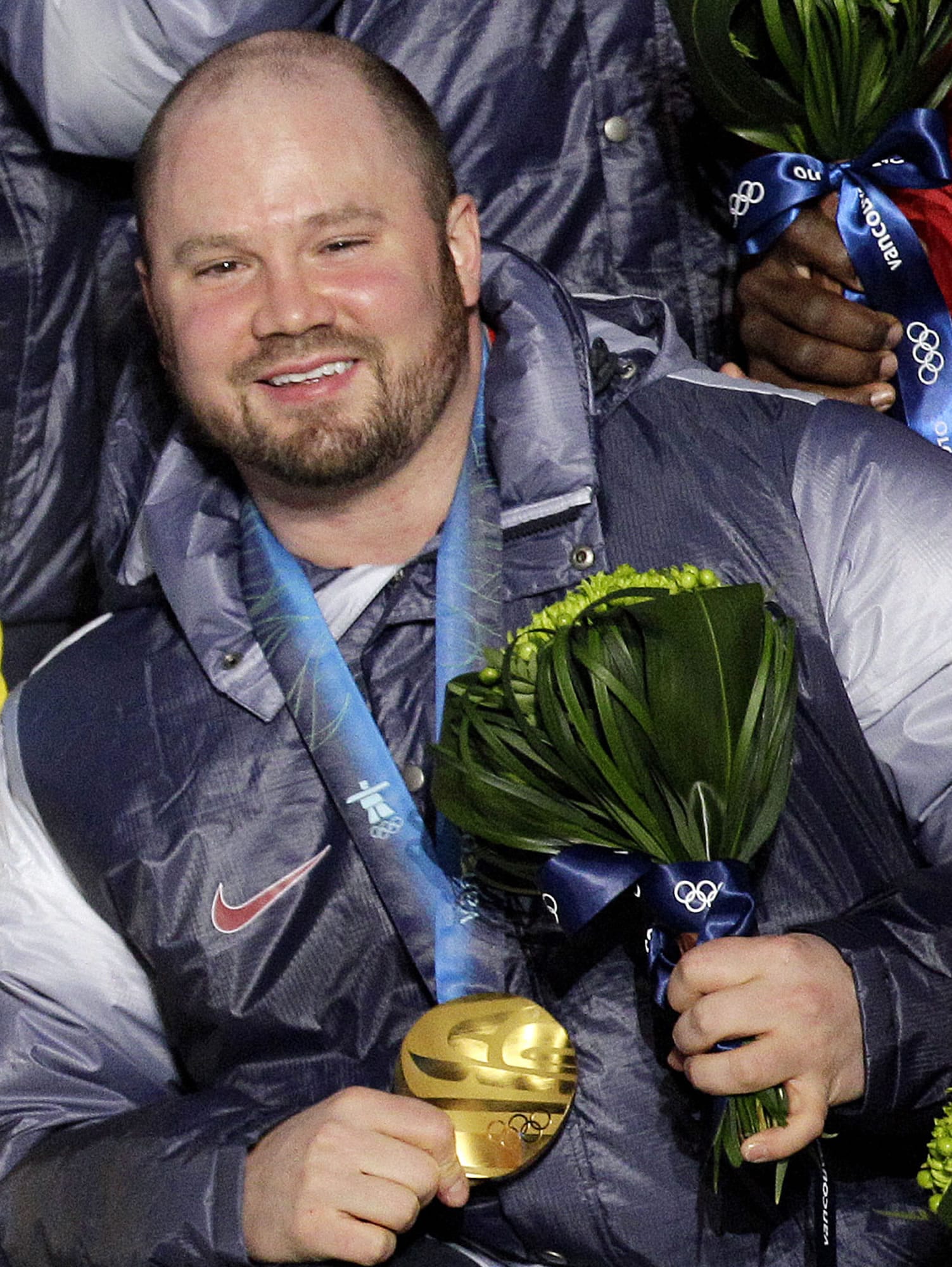Steven Holcomb poses with his gold medal in the men's four-man bobsled during the medal ceremony at the Vancouver 2010 Olympics in Whistler, British Columbia. Holcomb, the longtime U.S. bobsledding star who drove to three Olympic medals after beating a disease that nearly robbed him of his eyesight, was found dead in Lake Placid, N.Y., on Saturday, May 6, 2017. He was 37.