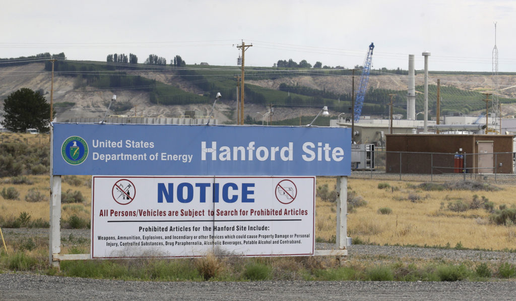 FILE - In this July 9, 2014 file photo, a sign informs visitors of prohibited items on the Hanford Nuclear Reservation near Richland, Wash. An emergency has been declared Tuesday, May 9, 2017, at the Hanford Nuclear Reservation after a portion of a tunnel that contained rail cars full of nuclear waste collapsed. Randy Bradbury, a spokesman for the Washington state Department of Ecology, said officials detected no release of radiation and no workers were injured.   (AP Photo/Ted S.