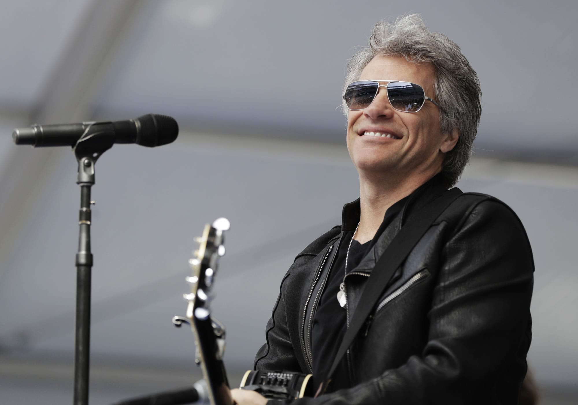 Musician Jon Bon Jovi performs during a surprise appearance at the Fairleigh Dickinson University commencement ceremony, Tuesday, May 16, 2017, at MetLife Stadium in East Rutherford, N.J. The school won a nationwide contest to bring the New Jersey-based band Bon Jovi to play their graduation by generating the most interest on social media.