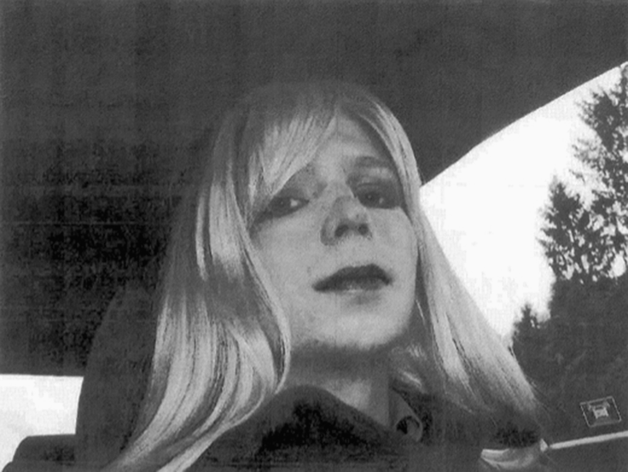 FILE - In this undated file photo provided by the U.S. Army, Pfc. Chelsea Manning poses for a photo wearing a wig and lipstick. Manning, the transgender soldier convicted in 2013 of illegally disclosing classified government information, will remain on active duty in a special status after her scheduled release from prison Wednesday, May 17, 2017. (U.S.