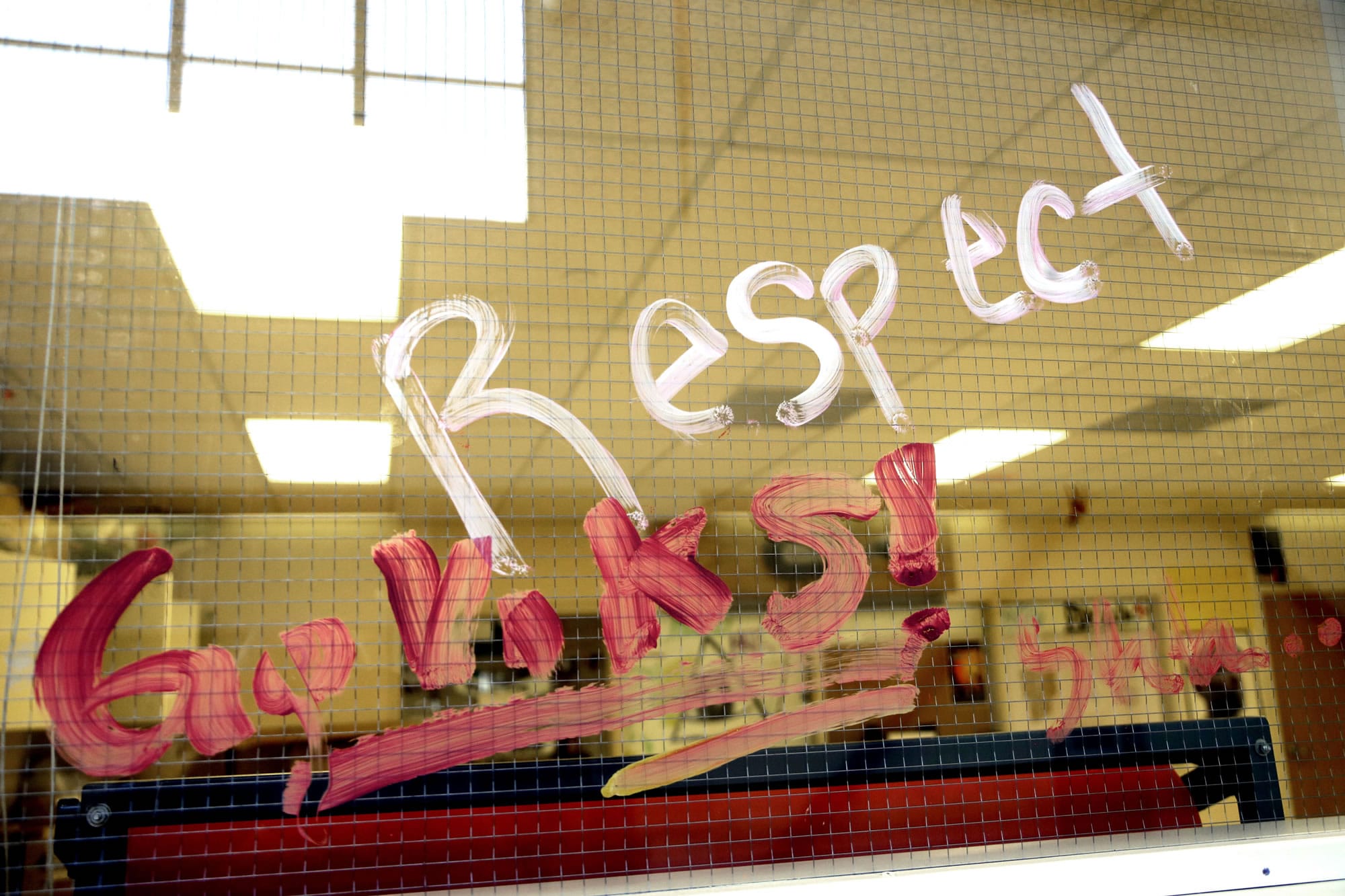 A hand-painted message is written on a classroom window at Forest Grove High School in Forest Grove, Ore., May 4, 2017. Experts who have treated young sexual offenders stress the value of early intervention, and research cites the importance of a culture that encourages students to report incidents without fear of retaliation and with the expectation that adults will do the right thing.