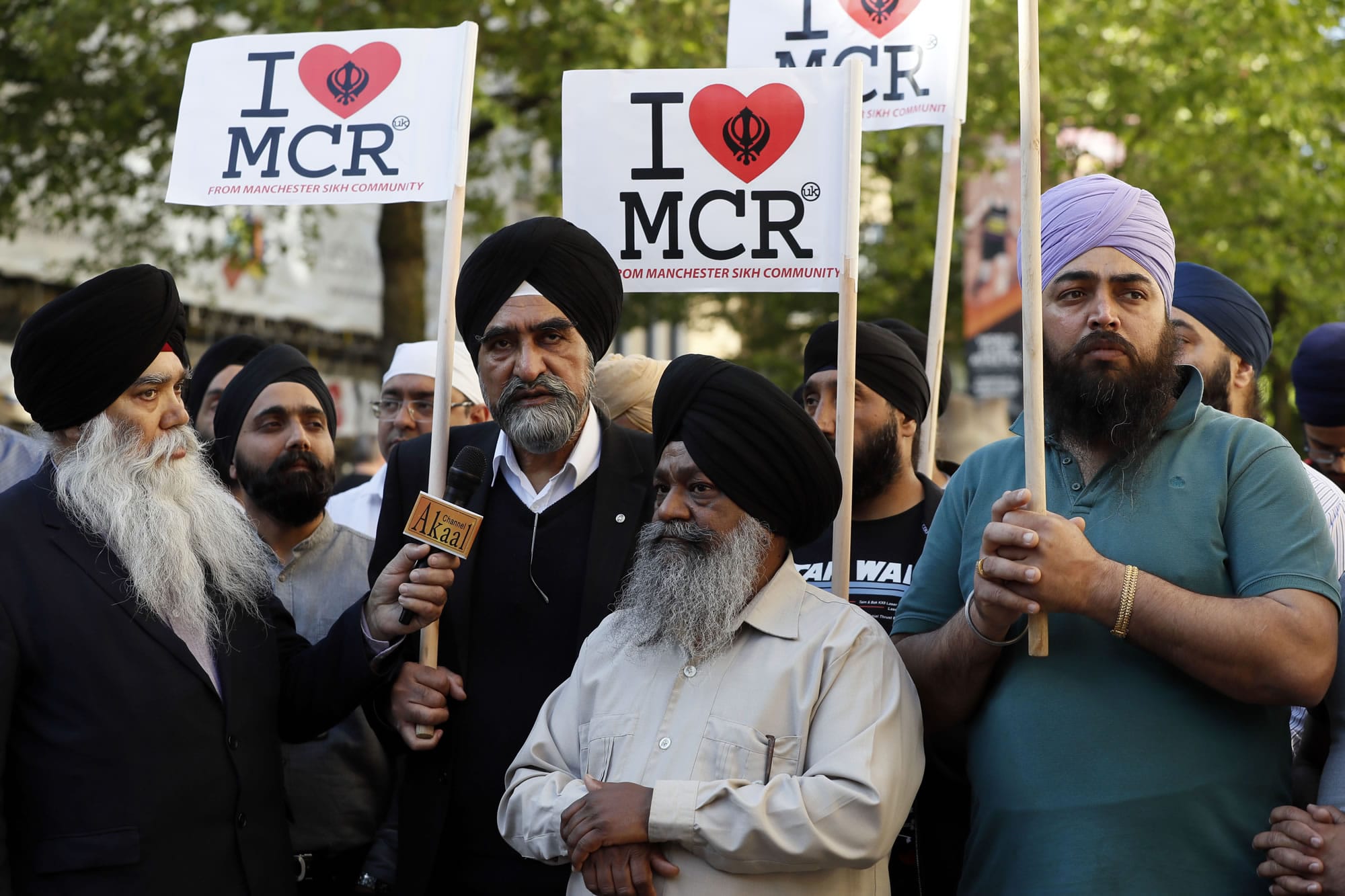 Members of the Manchester Sikh Community attend a vigil in Albert Square, Manchester, England, Tuesday May 23, 2017, the day after the suicide attack at an Ariana Grande concert that left 22 people dead as it ended on Monday night.