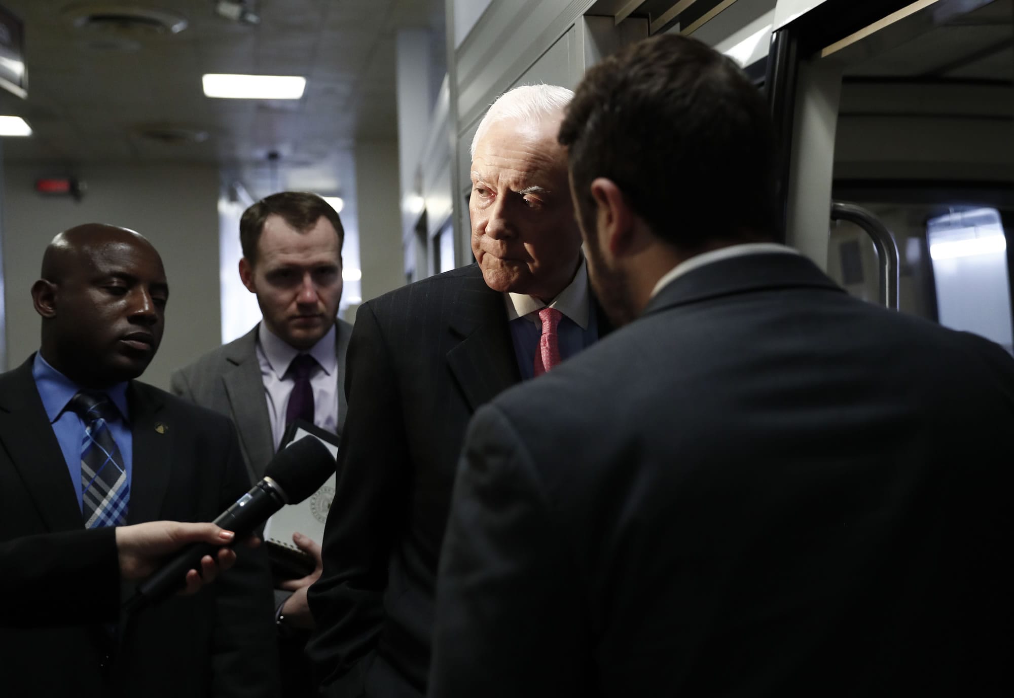 Sen. Orrin Hatch, R-Utah talk to a reporter as he steps onto the Capitol Subway on Capitol Hill in Washington, Wednesday, May 24, 2017.