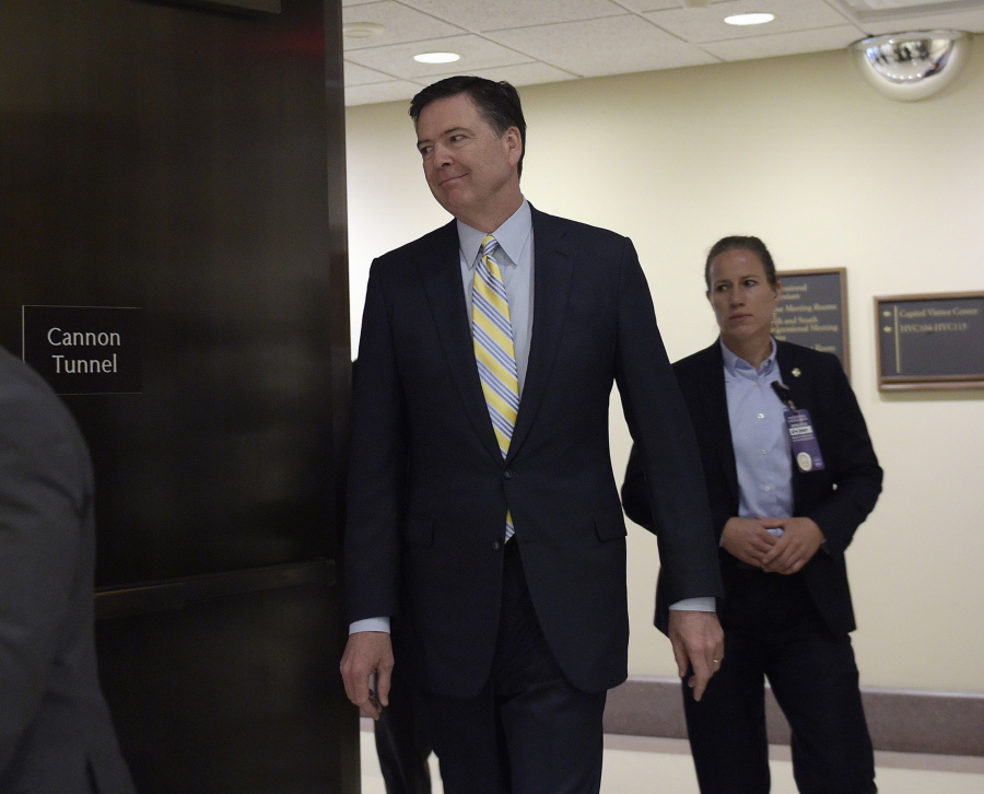 FBI Director James Comey walks on Capitol Hill in Washington, Thursday, May 4, 2017. Comey and National Security Agency Director Mike Rogers are meeting behind closed doors with members of a House committee investigating Russian meddling in the presidential election.