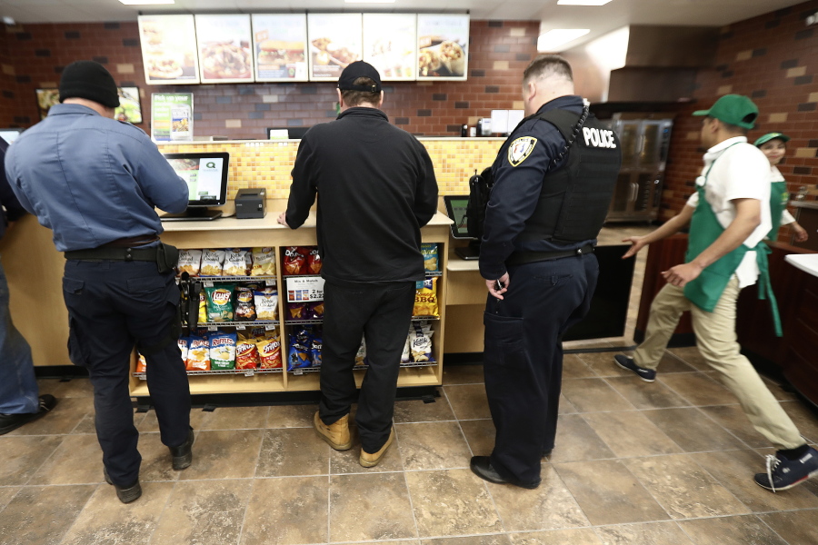Customers use a touch screen to order food March 23 at a QuickChek convenience store in Cedar Knolls, N.J.