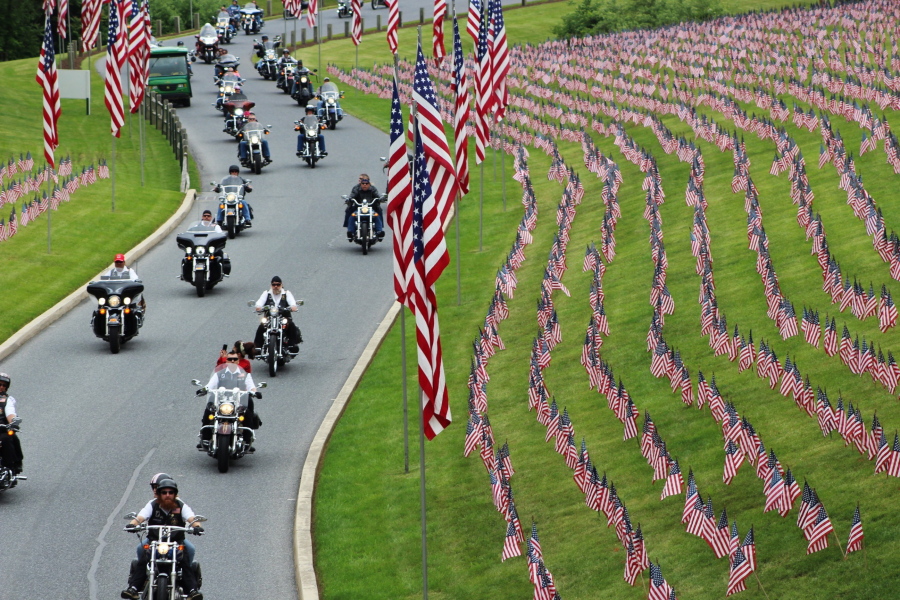 Motorcyclists ride Saturday into Indiantown Gap National Cemetery in Annville, Pa., for a Memorial Day weekend program. While millions of Americans celebrate the long Memorial Day weekend as the unofficial start of summer, some veterans and loved ones of fallen military members wish the holiday that honors the nation’s war dead would command more respect.