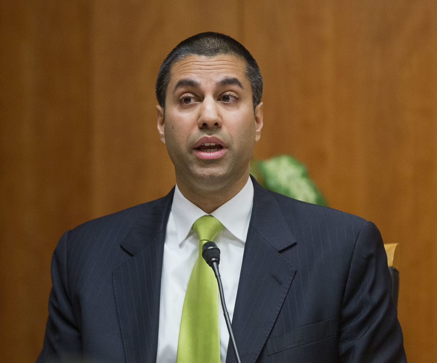 Federal Communication Commission Commissioner Ajit Pai speaks during an open hearing and vote on “Net Neutrality” in Washington.