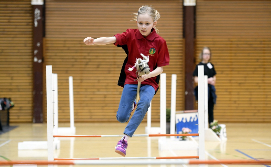 A girl competes during the hobby-horsing Finnish championships in Vantaa, Finland,  on April 29. About 200 competitors participated in the event.