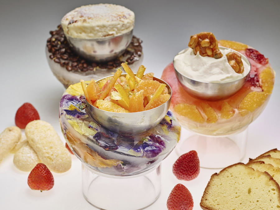 Decorative ice bowls filled with desserts.