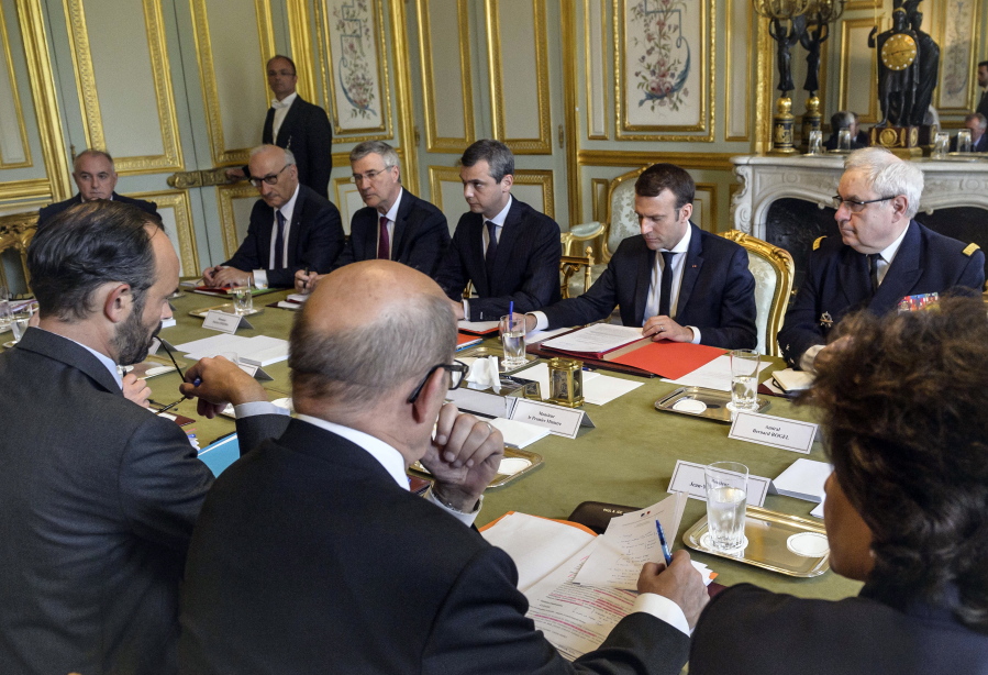 French President Emmanuel Macron, second right, chairs a security council meeting at the Elysee Palace in Paris on Thursday.
