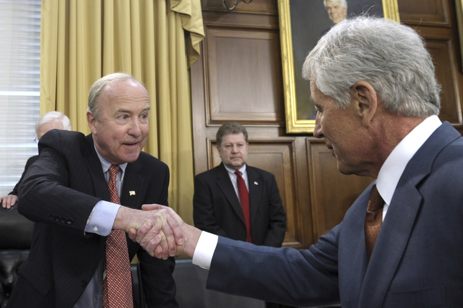 U.S. Rep. Rodney Frelinghuysen, left, R-N.J., chairman of the House Appropriations subcommittee on defense, shakes hands with Defense Secretary Chuck Hagel, right, prior to Hagel’s testimony on the Defense Department’s fiscal 2015 budget on Capitol Hill in Washington.