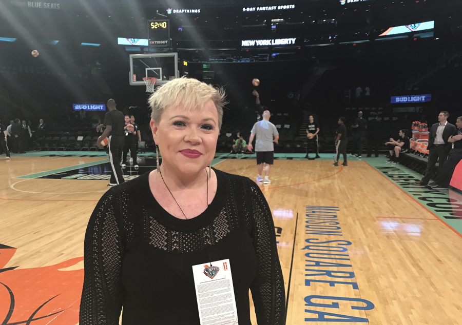 Holly Rowe stands on the court at Madison Square Garden in New York on Thursday, May 18, 2017, before a WNBA basketball game between the New York Liberty and the Minnesota Lynx. Rowe was back on the sidelines for her first WNBA game of the season Thursday night. Dashing for interviews with coaches between quarters or talking to NBA Commissioner Adam Silver, who attend the game, Rowe was in her element. It was a welcome reprieve for her from her bout with melanoma which has recurred and spread. Earlier in the day, ESPN announced that it had re-signed Rowe to a multiyear contract extension. She was worried she be one of the people ESPN let go last month.