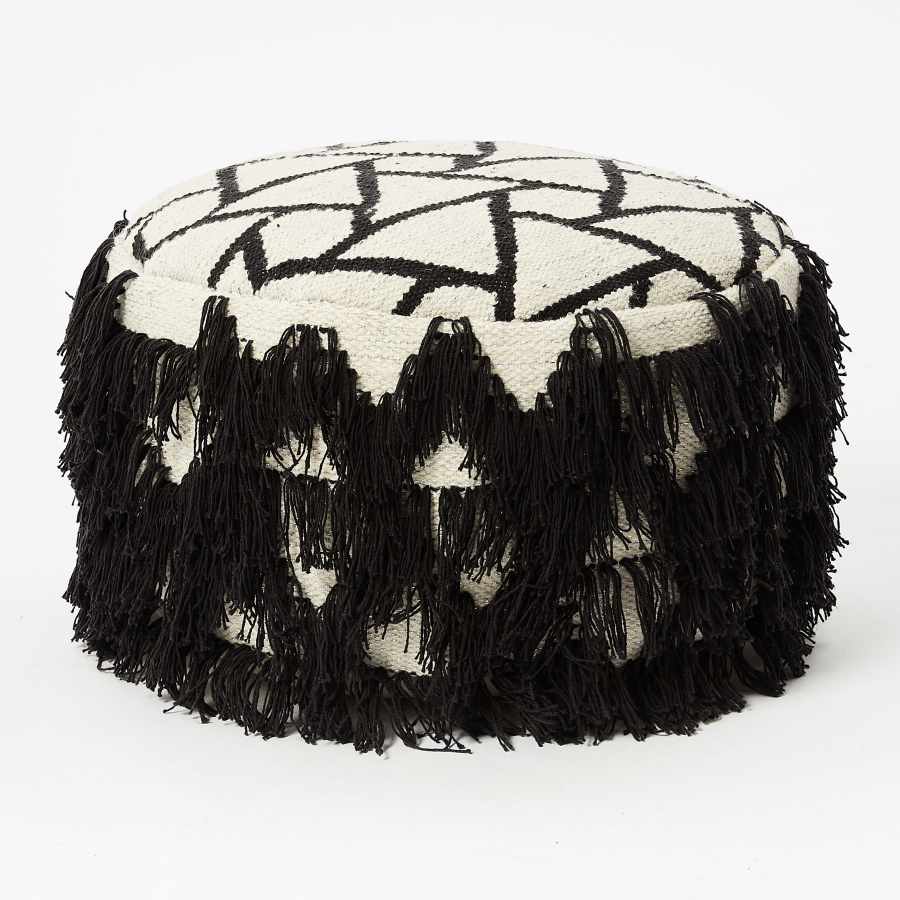 This undated photo provided by West Elm shows extra long fringe which creates a saucy skirt for a triangle-patterned Indian cotton pouf from West Elm.