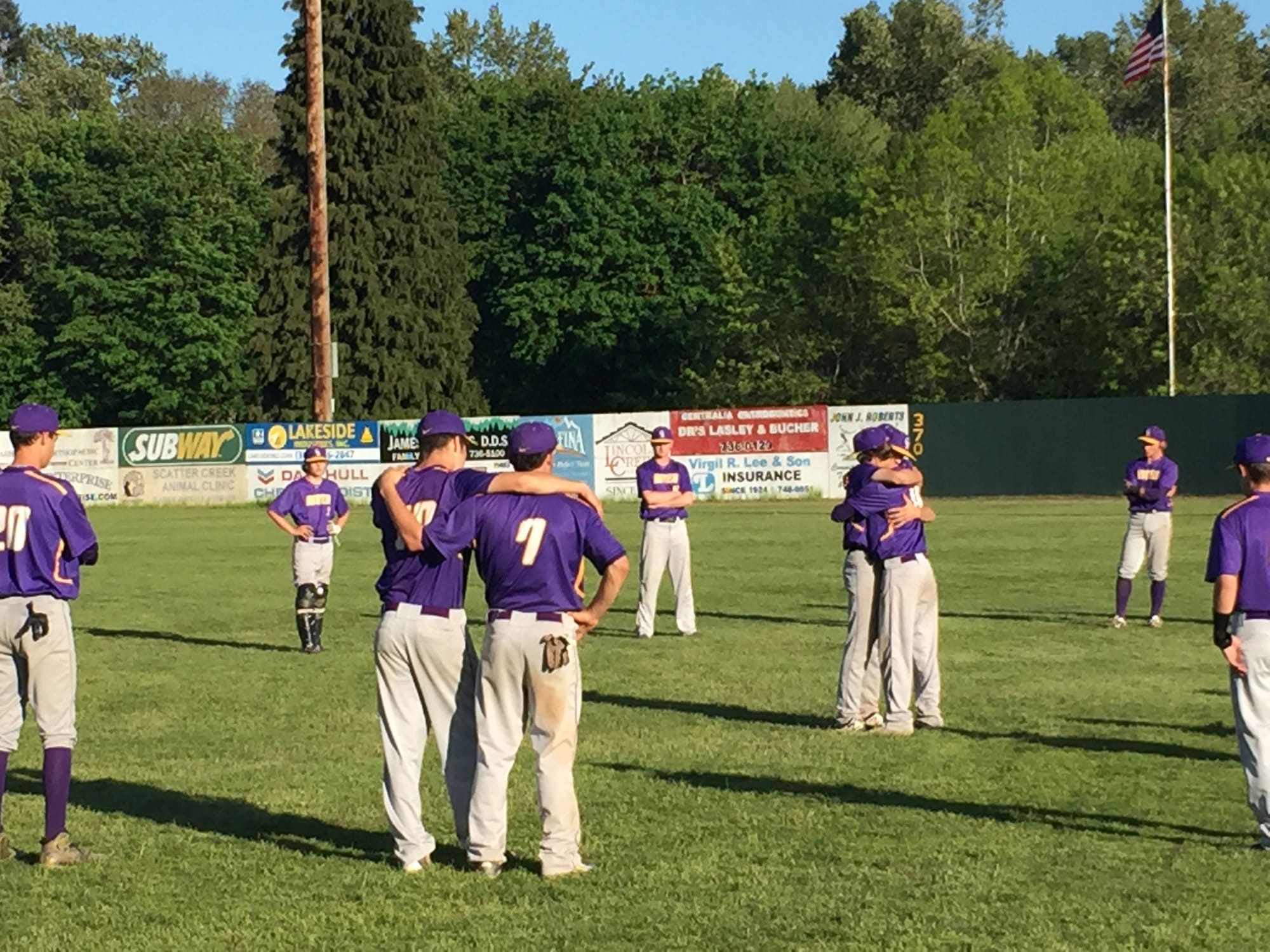 Members of the Columbia River baseball team hug after a 10-9 loss to W.F. West ended their season in the 2A state quarterfinals Saturday in Centralia.