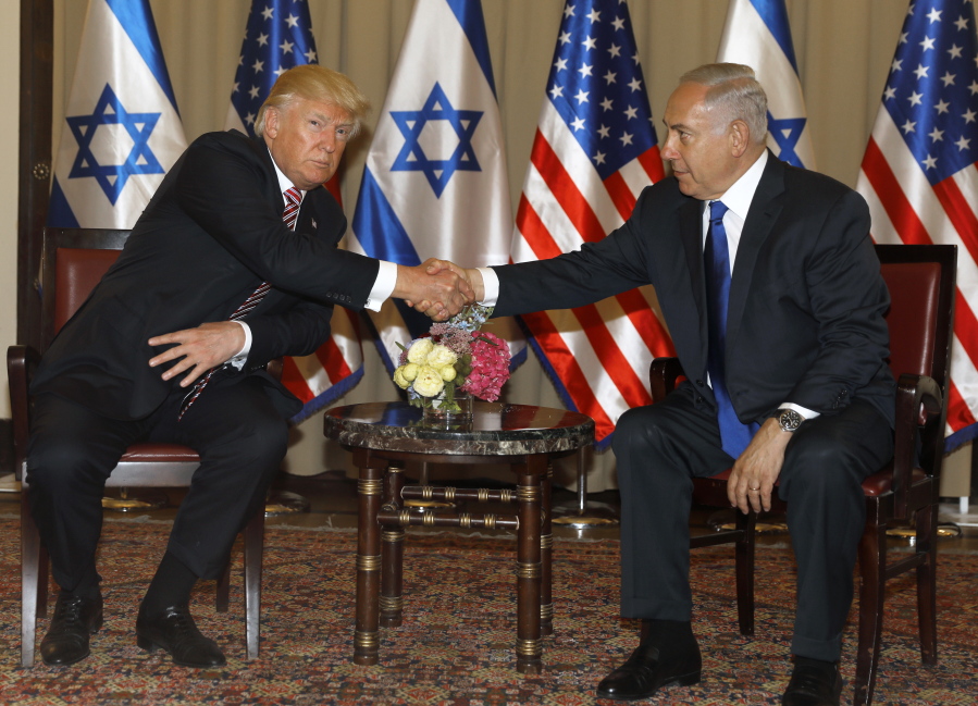Israel’s Prime Minister Benjamin Netanyahu, right and US President Donald Trump shake hands during a meeting in Jerusalem on Monday. President Donald Trump is opening his first visit to Israel Monday, saying he sees growing recognition among Muslim nations that they share a “common cause” with Israel in their determination to counter the threats posed by Iran.