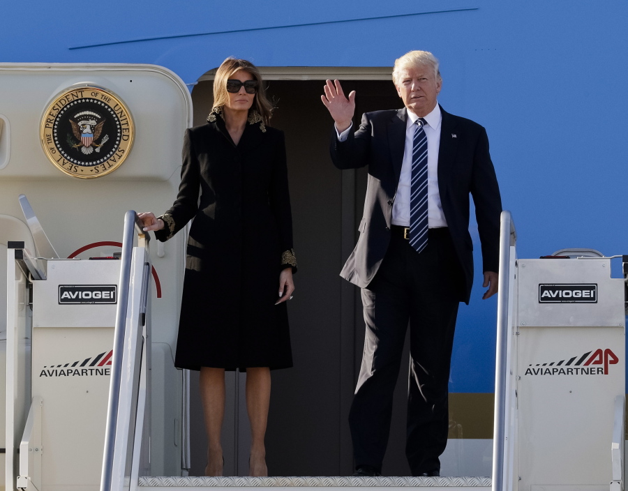 President Donald Trump and his wife, Melania, arrive at Fiumicino’s Leonardo Da Vinci International airport, near Rome, on Tuesday. Trump is in Italy for a two day visit, including a meeting with Pope Francis at the Vatican, ahead of his participation in a NATO meeting in Brussels on Thursday.