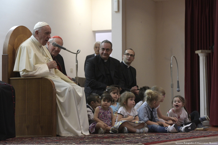 Pope Francis speaks in the Rome suburb of Acilia during a parish visit, in the outskirts of Rome,on Sunday.