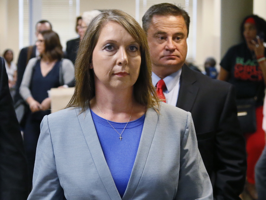Betty Shelby leaves the courtroom Wednesday with her husband, Dave Shelby, right, after the jury in her case began deliberations in Tulsa, Okla. Shelby was acquitted of manslaughter in the shooting of Terence Crutcher, an unarmed black man.