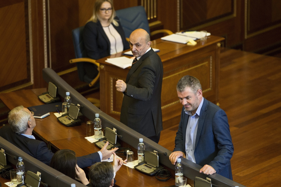Kosovo prime minister Isa Mustafa, centre, gestures at lawmakers after the government lost a no-confidence motion during a parliamentary session in capital Pristina, Kosovo on Wednesday.  Kosovo&#039;s government led by Prime Minister Isa Mustafa has lost a no-confidence vote, setting up the stage for early elections.