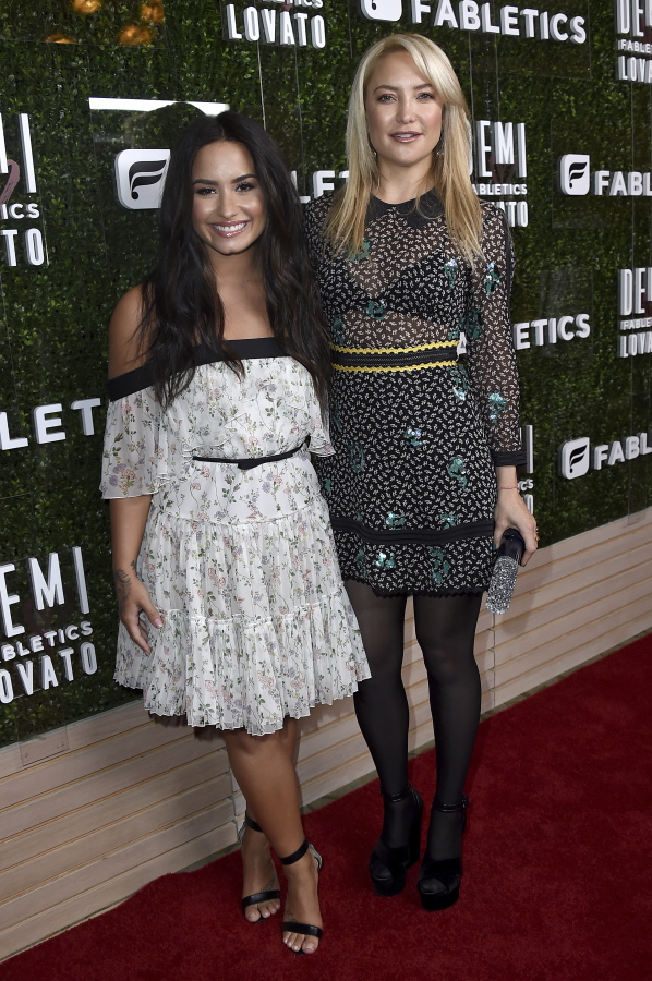 Demi Lovato, left, and Kate Hudson arrive at the launch of Demi Lovato and Fabletics Collaboration Collection on May 10 in Beverly Hills, Calif.