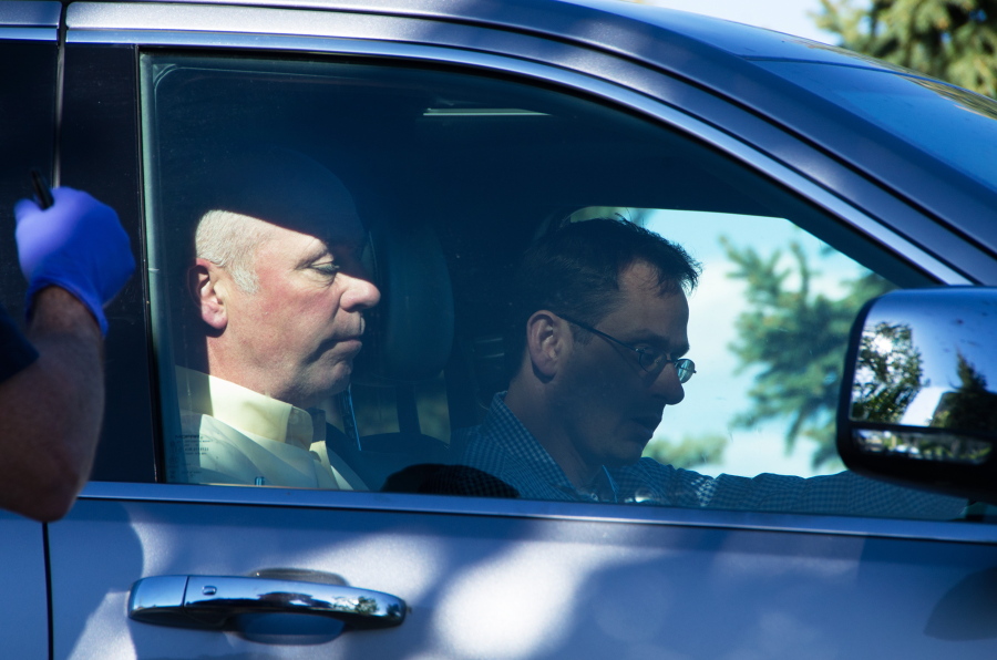 Republican candidate for Montana’s only U.S. House seat, Greg Gianforte, sits in a vehicle near a Discovery Drive building Wednesday in Bozeman, Mont. A reporter said Gianforte “body-slammed” him Wednesday, the day before the special election.